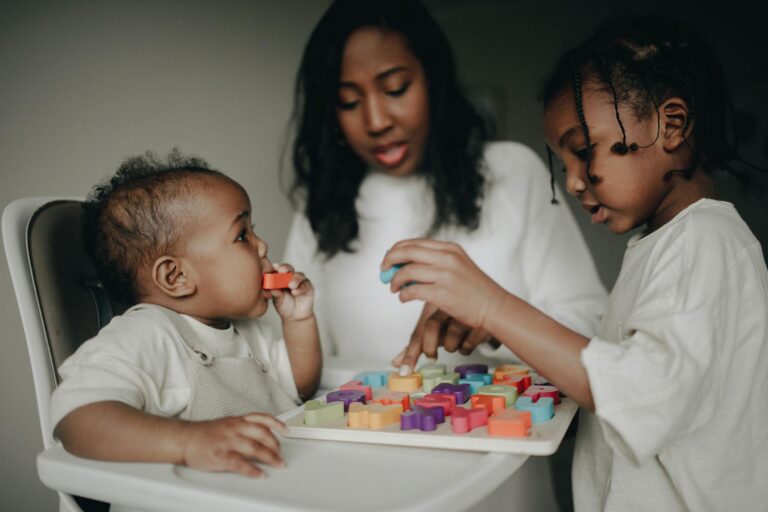 A mother and her children enjoy playing with colorful educational toys, learning together at home.